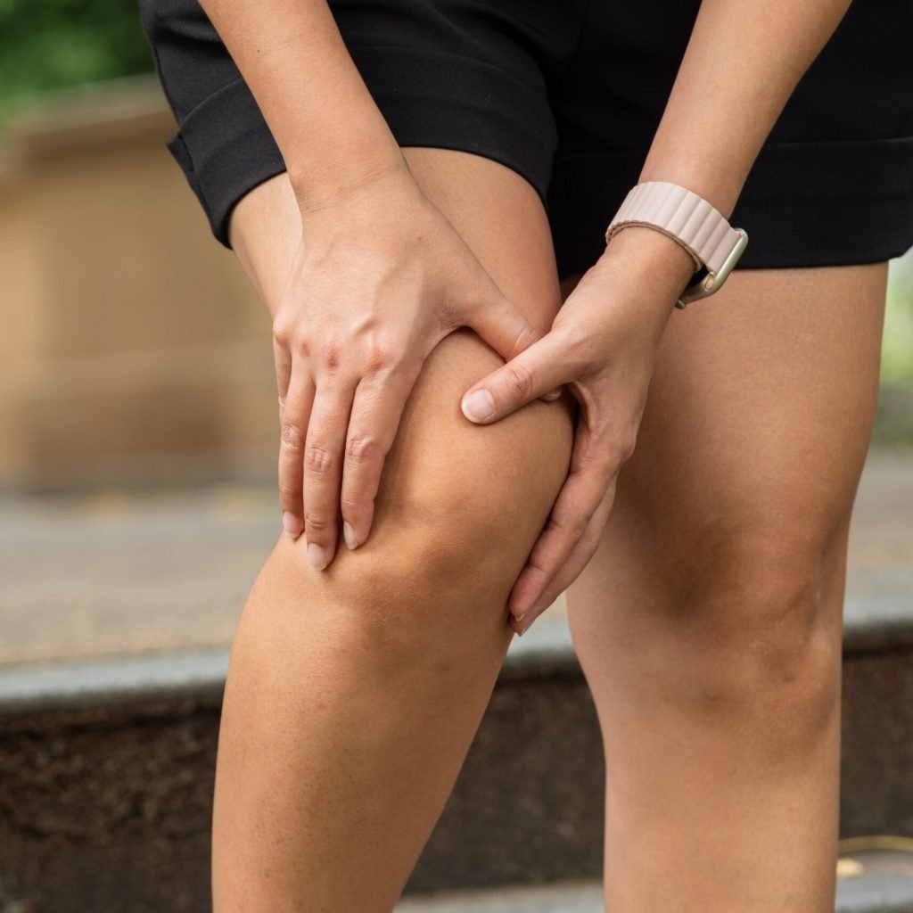 Knee pain woman He puts his hands on his knees, pain points from osteoarthritis and bone diseases, medical concepts and treatments. Knee pain woman He puts his hands on his knees, pain points from osteoarthritis and bone diseases, medical concepts and treatments.